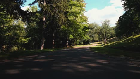 reverse track through the entrance of the cemetery gates