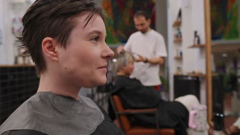 people getting haircuts at a hair salon