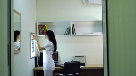 medical professional reviewing x-rays in a clinic