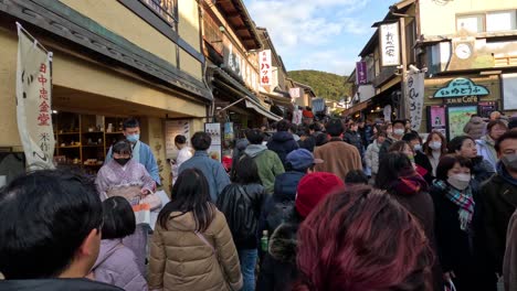 crowded market street with diverse visitors and shops