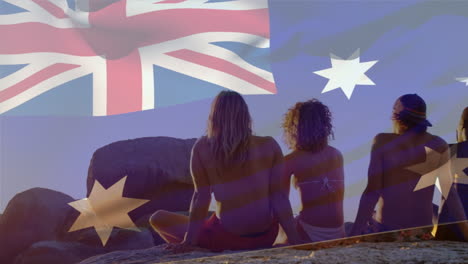 animation of flag of australia over diverse group of friends at beach