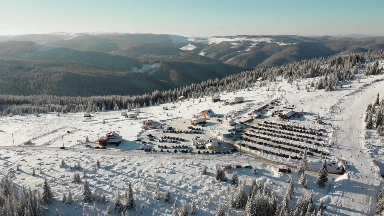 Aerial View of a Snowy Ski Resort in the Mountains