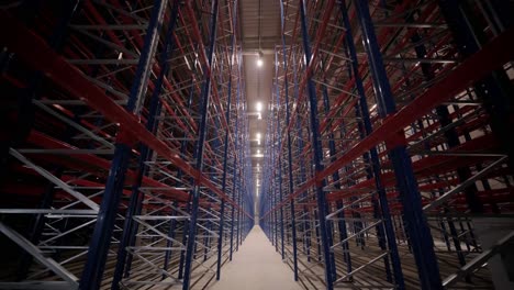 big and modern warehouse under construction, featuring metal shelving and other industrial equipment.