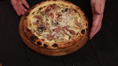 delicious homemade pizza with prosciutto and mushrooms