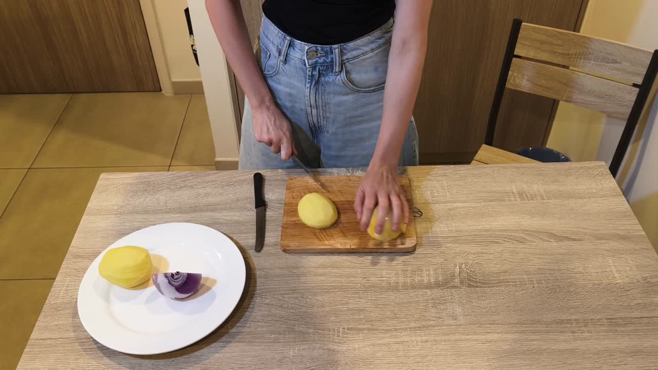 Cutting potatoes and onion