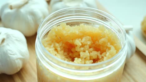 Close-up-of-minced-garlic-in-a-container-,