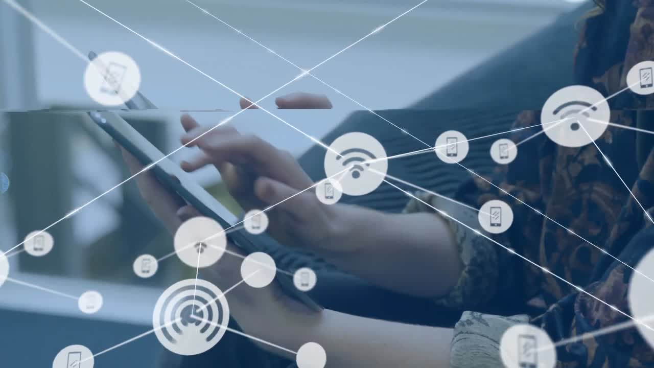 Animation of network of digital icons against mid section of a businesswoman using tablet at office