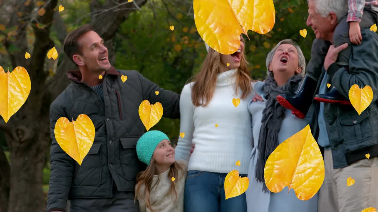 Animação de folhas de outono caindo sobre família caucasiana multigeração feliz em parque de outono.