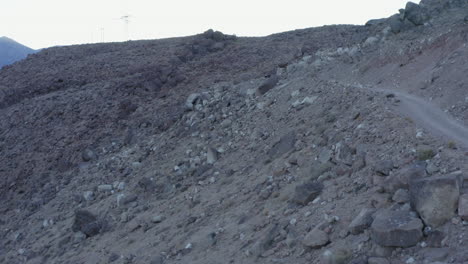 group of cross country mountain bikers meeting on an off-road trail: aerial view
