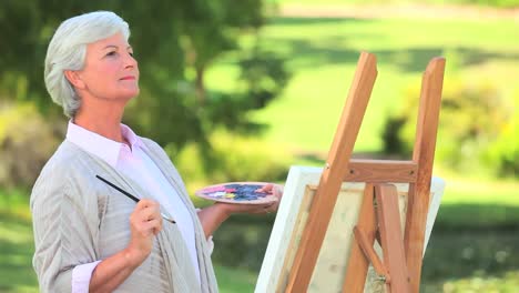 Mature-woman-painting-