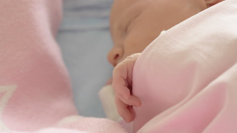 a closeup of a sleeping newborn girls face