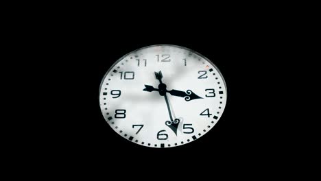 large frozen city clock at night. timelapse one hour. close up. solid black background.