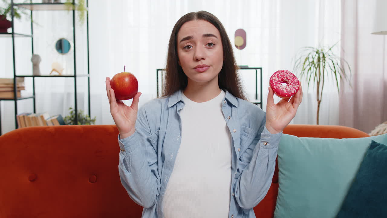 Choosing right nutrition pregnant woman comparing choosing between sweet donut and ripe apple