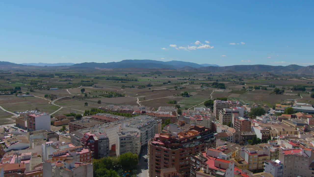 A close-up Drone flight over The Atalaya Castle tower in Villena, Province of Alicante, southern Spain. Located over a spur of the Sierra de la Villa.