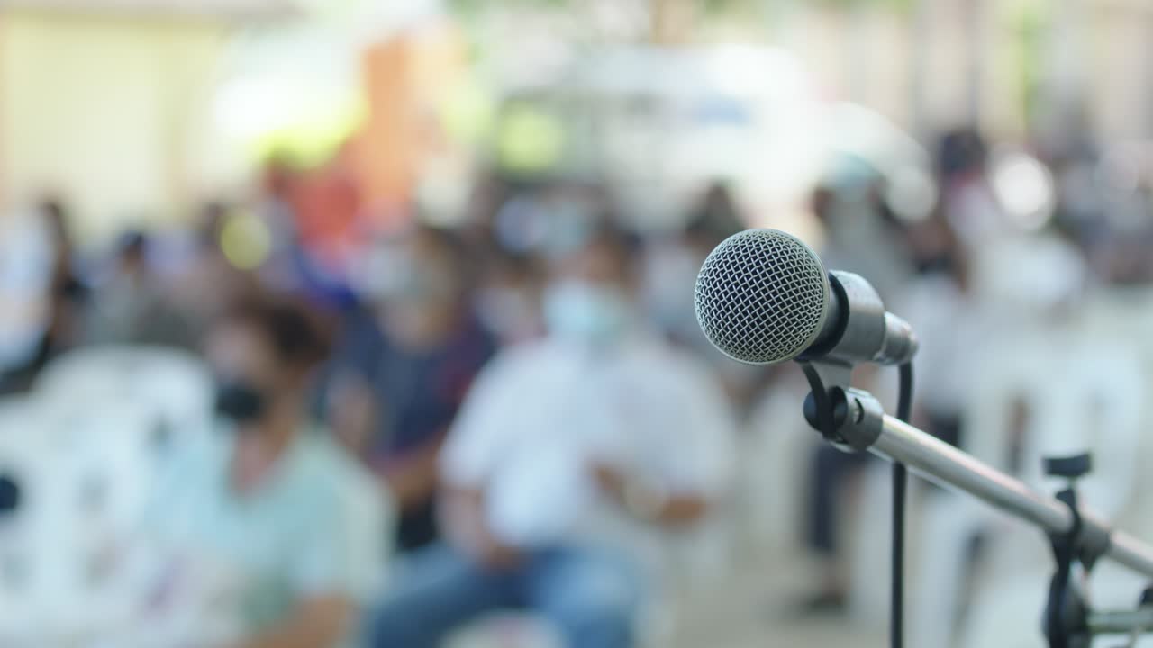 Microphone on the stand is standing on the stage