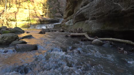 Mountain-river-splashing-and-cascading-down-rocky-steps-in-static-view