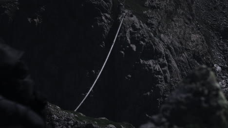 mountain hiking adventure with rope bridge