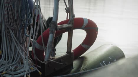 close-up of safety lifebuoy attached to vessel railing