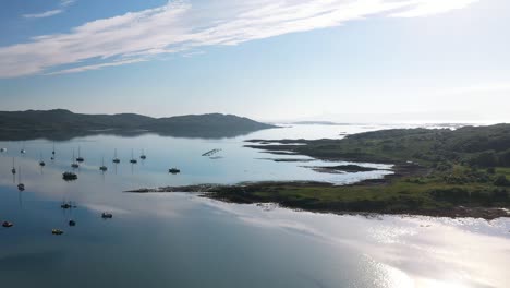 aerial footage flying out of arisaig harbour towards isle of eigg