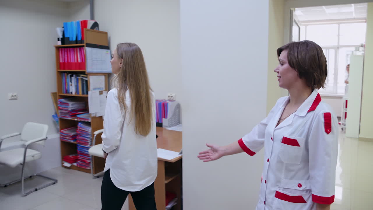 Doctor Inviting Patient. Ophthalmologist with client in hospital