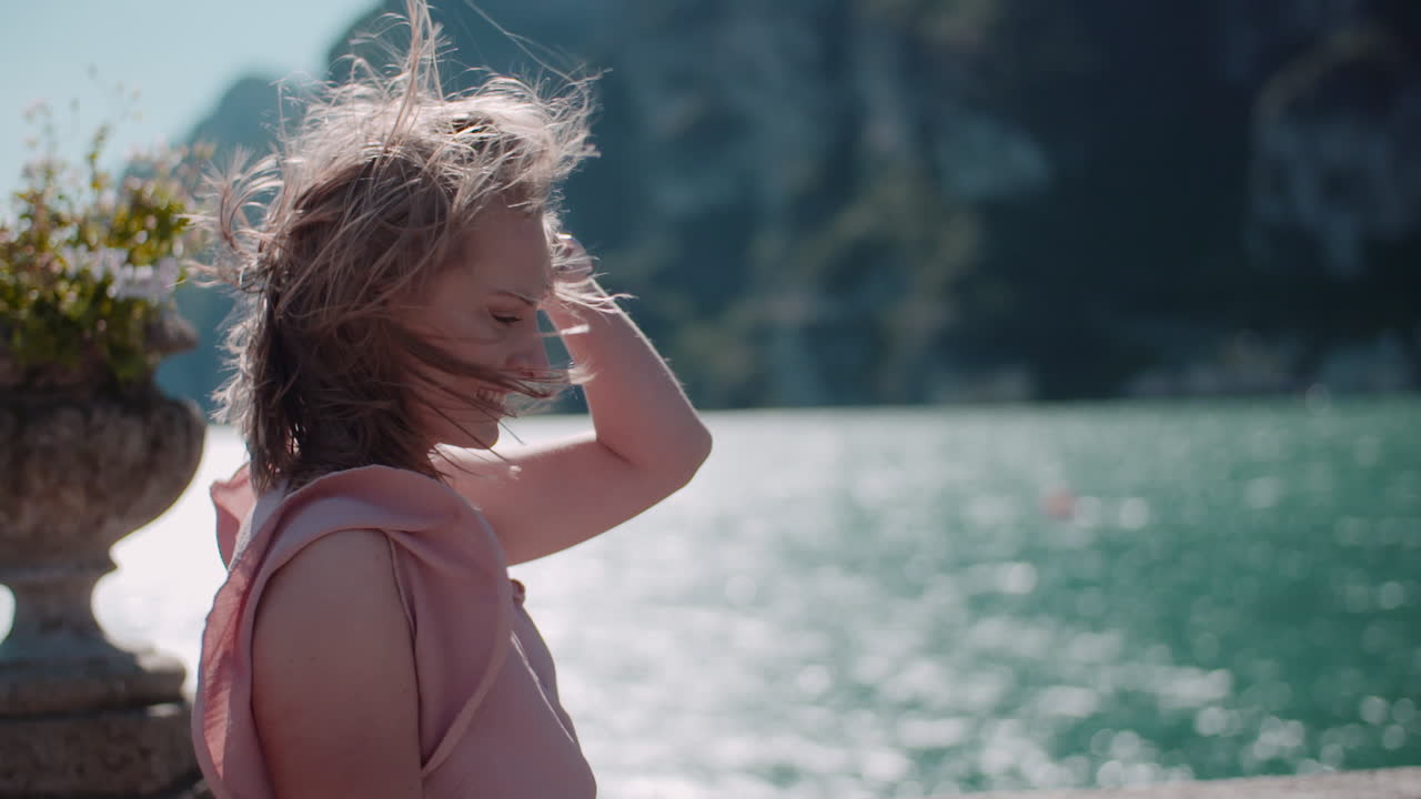 Woman Walking by Seaside Village
