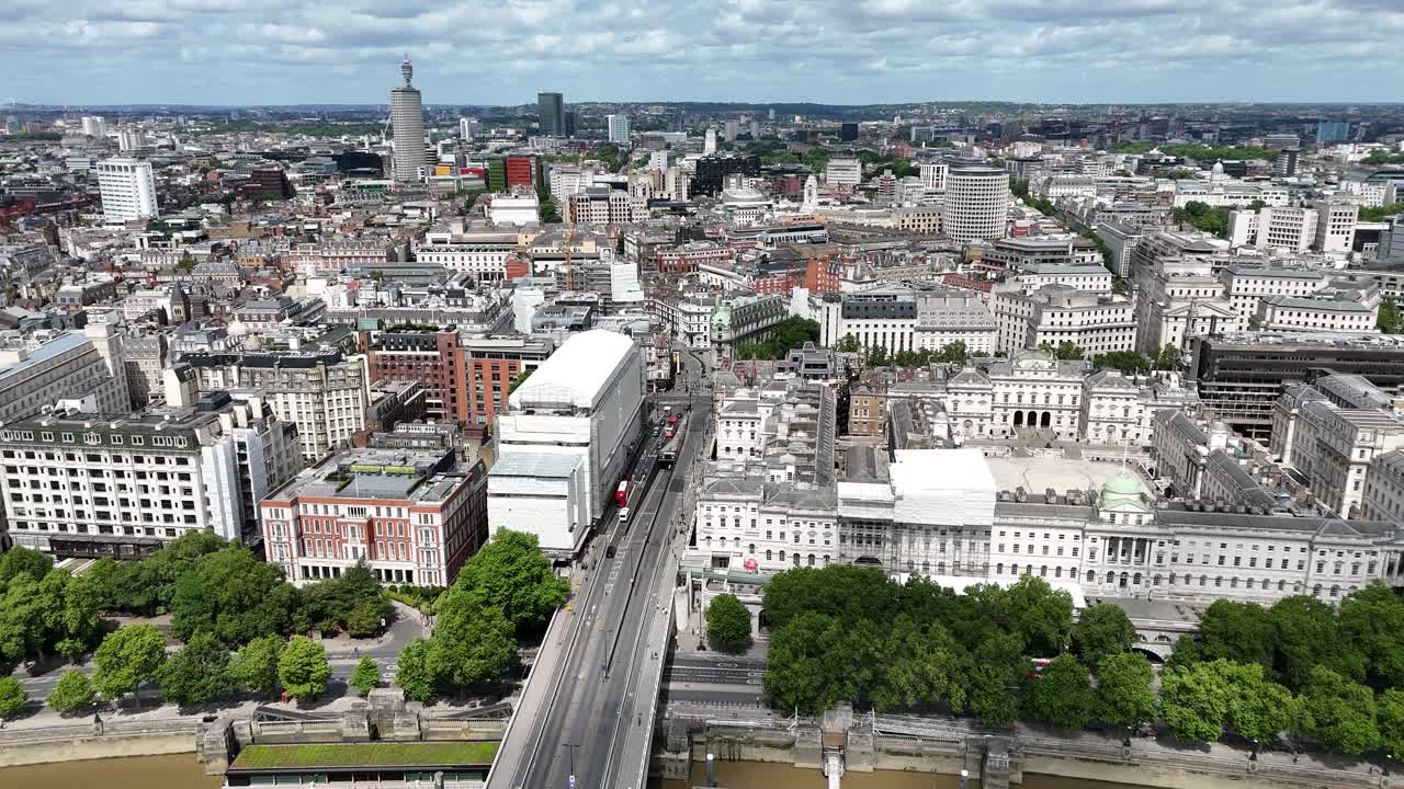 Aerial footage heading north over Waterloo Bridge and the River Thames, revealing iconic London landmarks including Covent Garden and the British Museum, with stunning cityscape views.