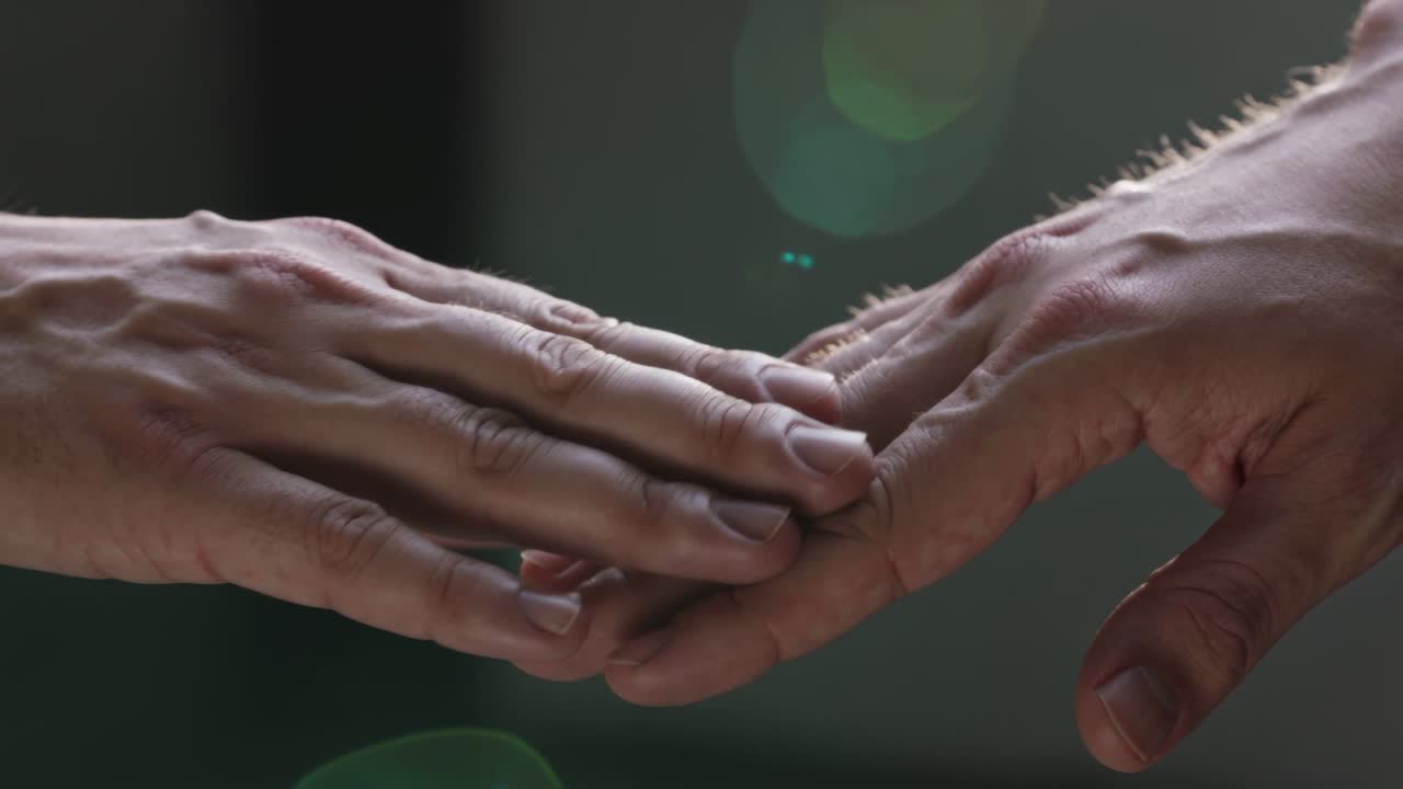 Two sets of hands approaching, meeting, sliding and stroking while maintaining contact for comfort