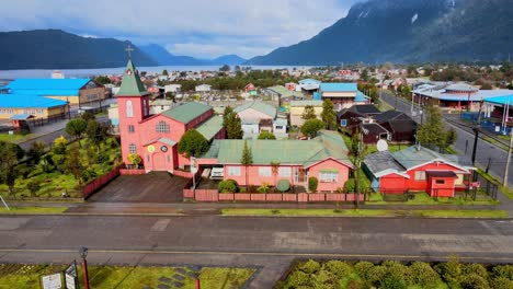 Aerial-spin-of-the-church-of-Hornopiren,-Hualaihue,-Chile