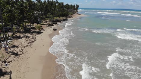 An-aerial-view-of-a-beach-in-the-carribean,-captured-by-a-drone-in-4k