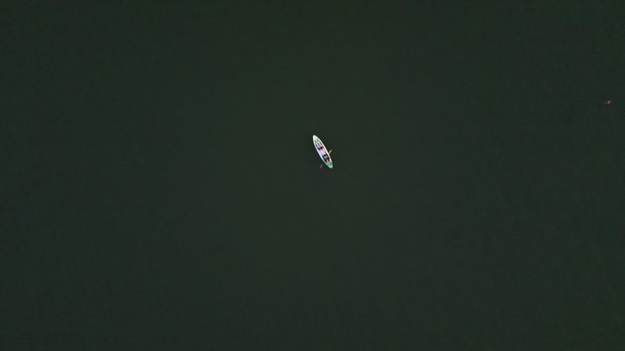 Canoeist Rowing on a Lake Viewed from Above in Thailand.