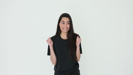 young woman expressing happiness and excitement on white background