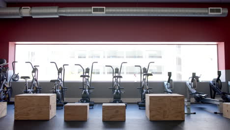 a modern gym interior with exercise equipment, with copy space