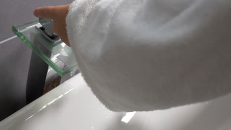 washing hands under the modern tap