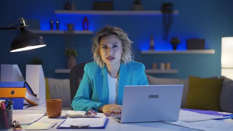 home office worker woman looking at camera confused.