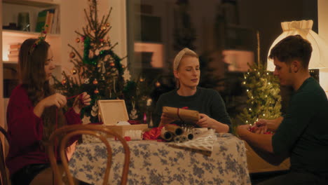 woman showing christmas present to male friend