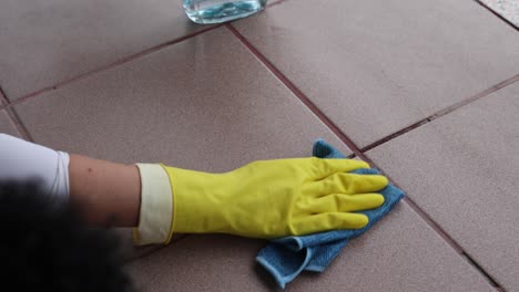 woman cleaning tile floors outdoors, spring cleaning, 4k footage