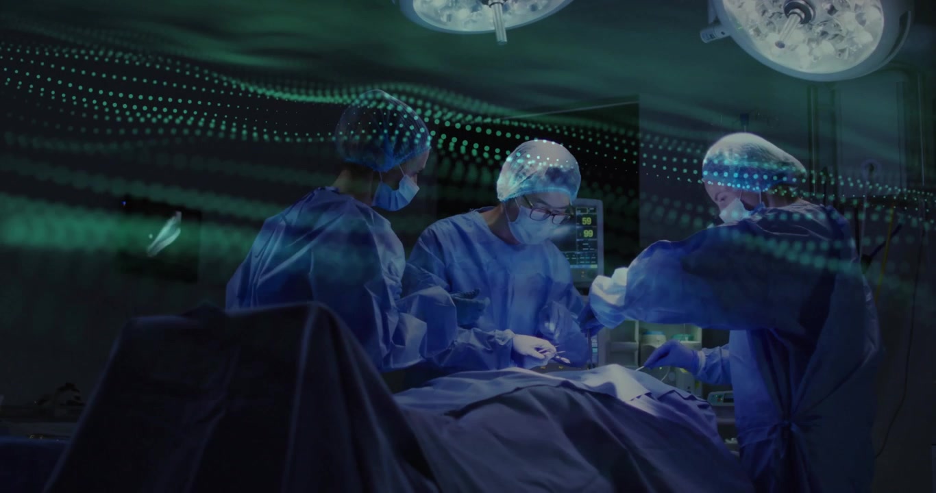 surgical team performing surgery in operating room, showing animated green waveform on monitor