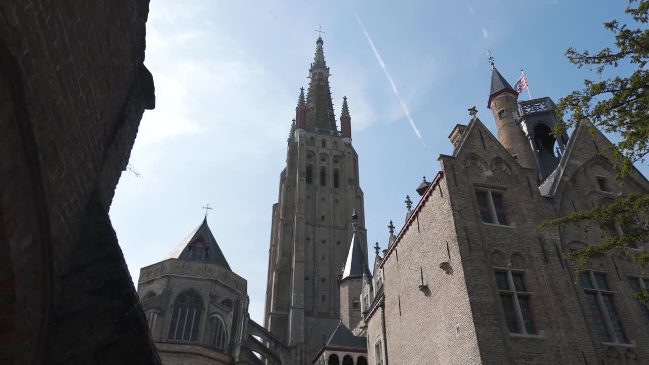 Majestic spire of Church of Our Lady in Bruges, a cultural and architectural marvel of Belgium
