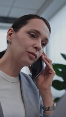 woman on phone in office