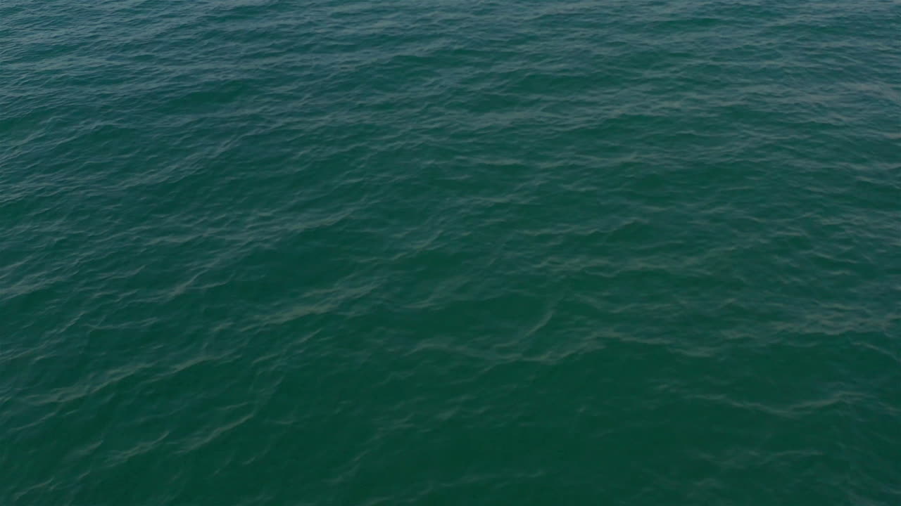 Aerial footage over Shore and waves in Mediterranean sea