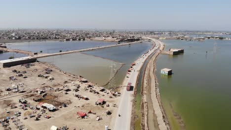 Aerial-Flying-Towards-Of-Makeshift-Camps-For-Flood-Disaster-Victims-In-Mehar,-Sindh