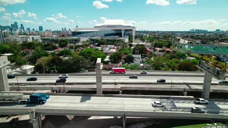 urban bridge construction with launching gantry over dolphin expy highway in miami, florida, usa