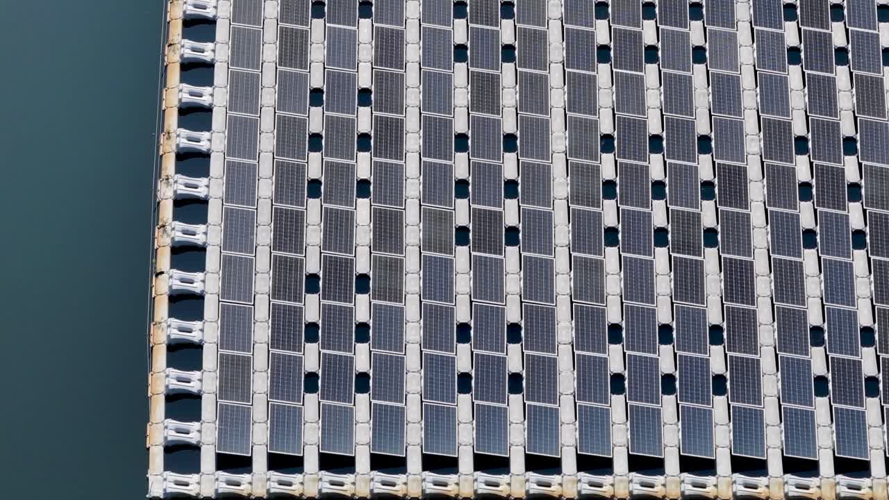 Low flight over a large floating solar panel array on a lake in New Jersey