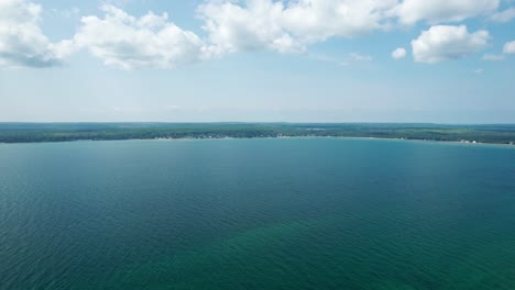 Drone-aerial-shot-high-above-the-bay-in-bailey's-harbor,-Wisconsin