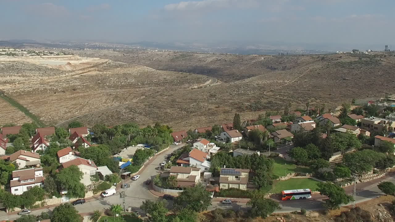 Aerial Footage of a Residential Community in a Hilly, Arid Region