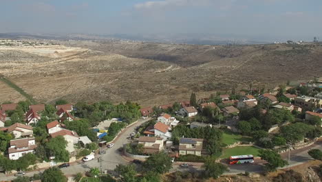 aerial footage of a residential community in a hilly, arid region