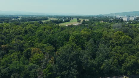 aerial - treeline separates farmlands from dense forest near city outskirts in zagreb croatia