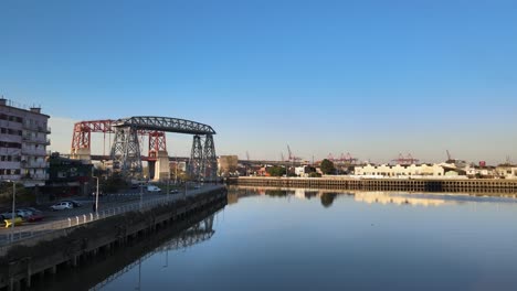 4K-Aerial-Drone-Footage-of-Historic-Transporter-Bridge-Known-as-Puente-Transbordador-in-Buenos-Aires-La-Boca,-Argentina