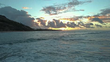 low angle view of hawaiian sunrise with clouds and blue sky silhouette