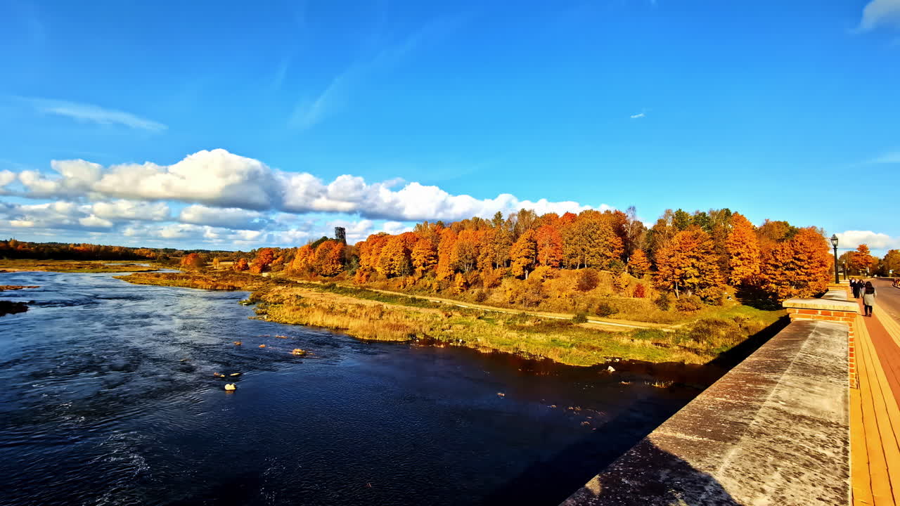 Kuldīga brick bridge over Venta river, Latvia, with autumn colors